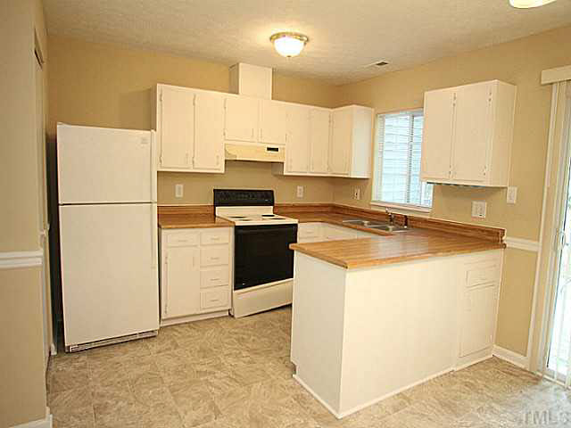 2113 Mariner Circle Raleigh, NC 27603 - Photo 4 of 13 Freshly painted cabinets and flooring with a large pantry