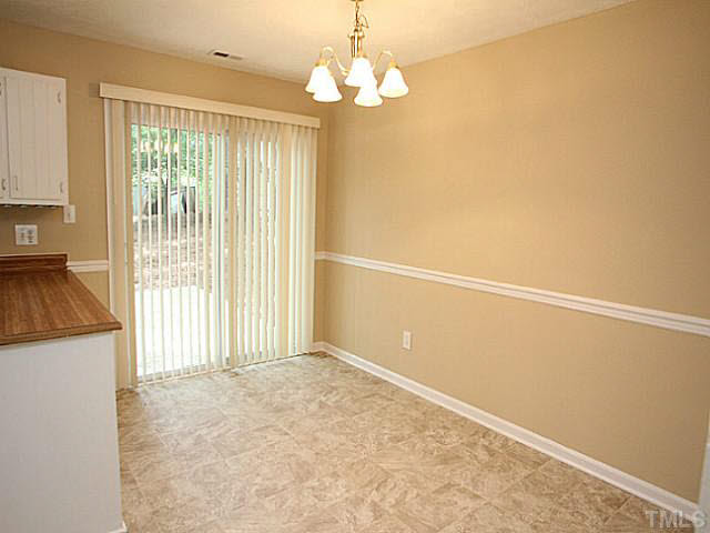2113 Mariner Circle Raleigh, NC 27603 - Photo 5 of 13 Dining area right off the kitchen open to a view of the spacious backyard