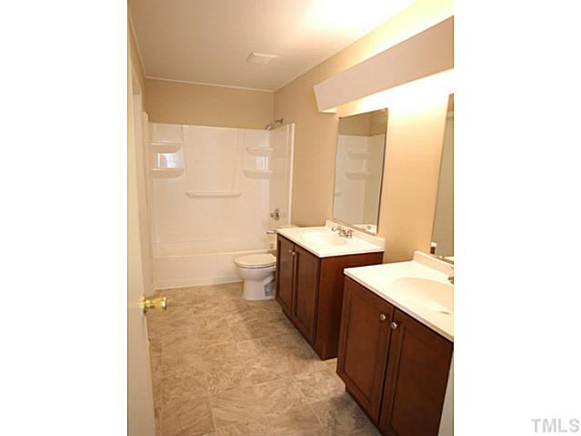 2113 Mariner Circle Raleigh, NC 27603 - Photo 7 of 13 Master bath on first floor with double vanities.