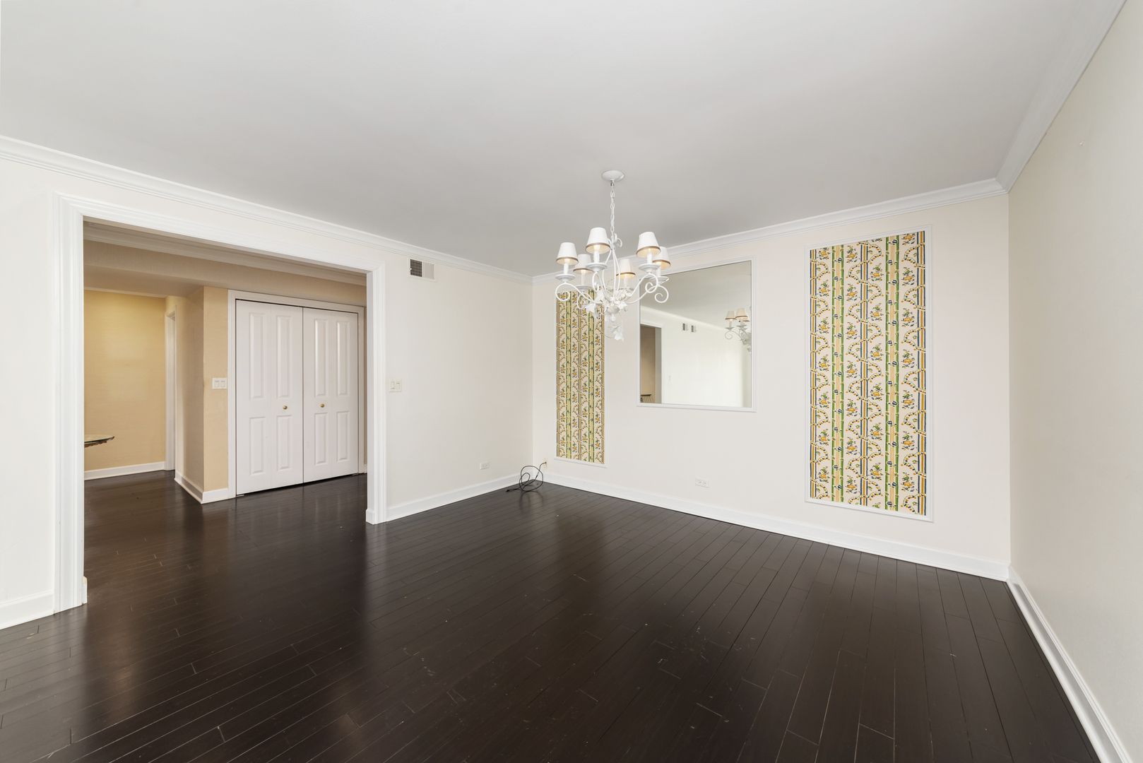 1-s150 Spring Road, Unit 2D Oak Brook, IL 60181 - Photo 11 of 22 a view of an empty room with wooden floor and a window