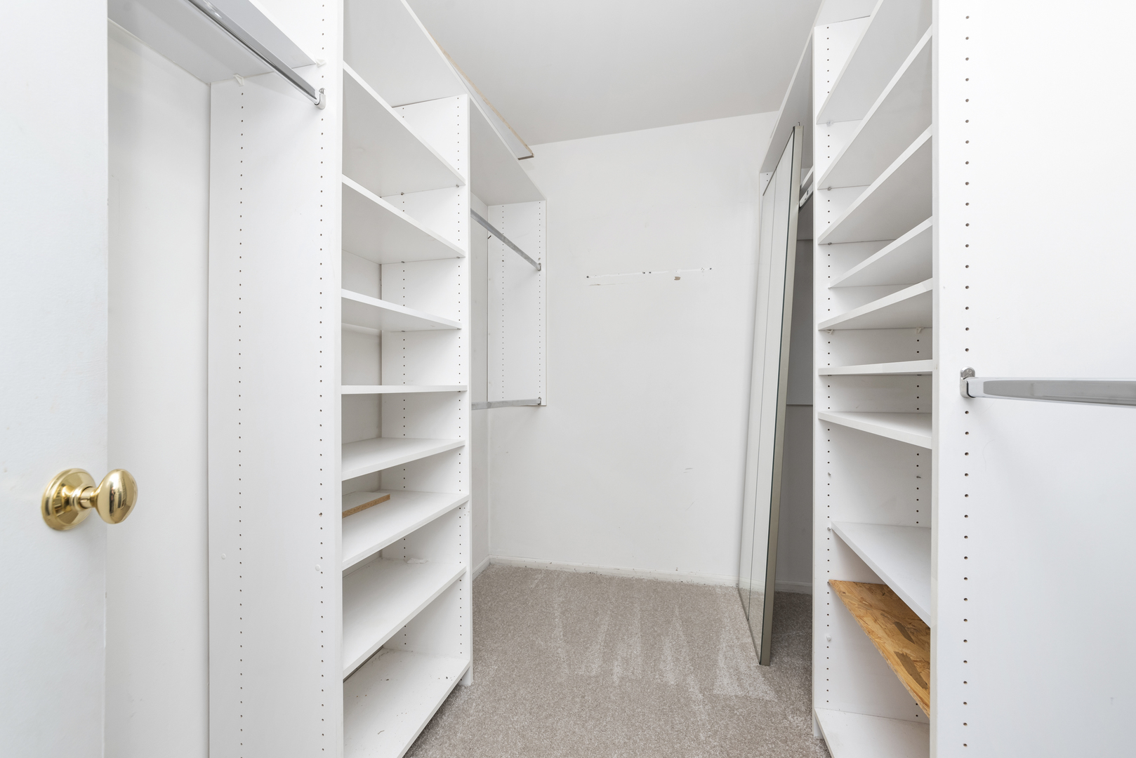 1-s150 Spring Road, Unit 2D Oak Brook, IL 60181 - Photo 14 of 22 a view of walk in closet with empty racks