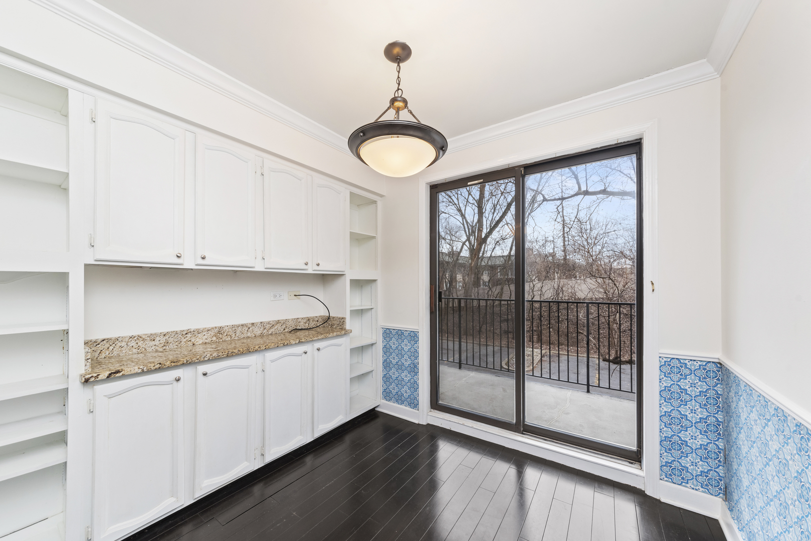 1-s150 Spring Road, Unit 2D Oak Brook, IL 60181 - Photo 8 of 22 a kitchen with a sink and a large window