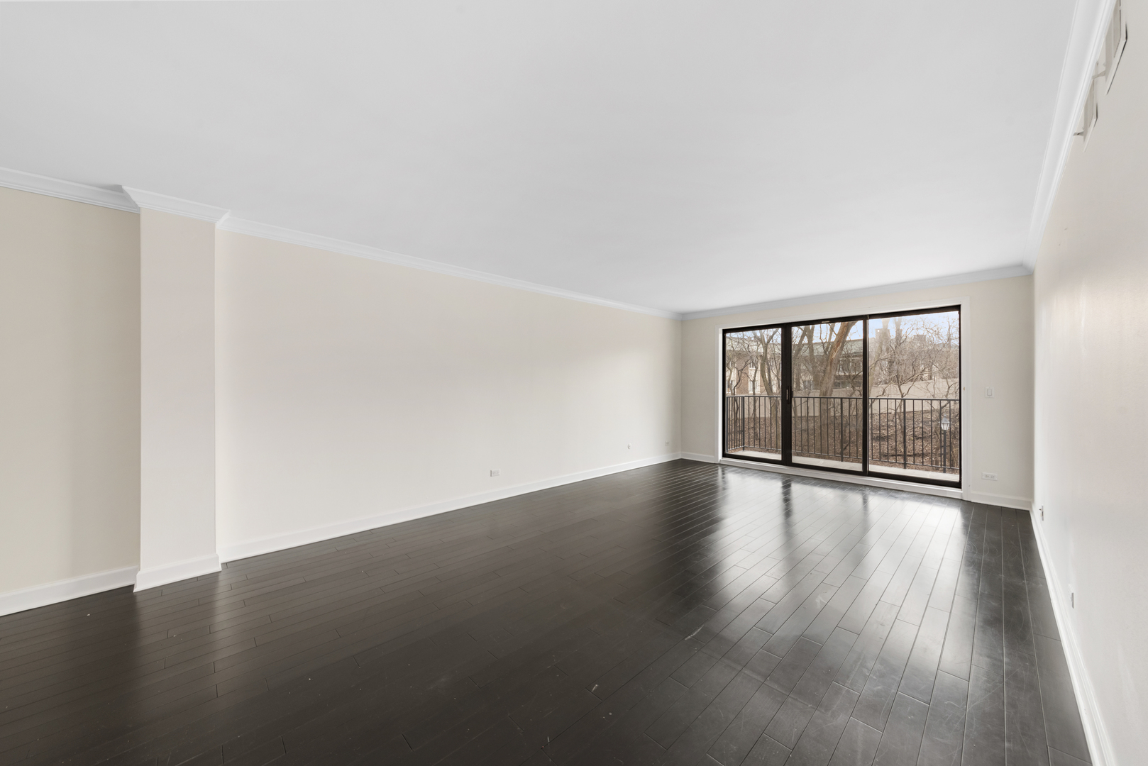 1-s150 Spring Road, Unit 2D Oak Brook, IL 60181 - Photo 9 of 22 a view of wooden floor and windows in a room