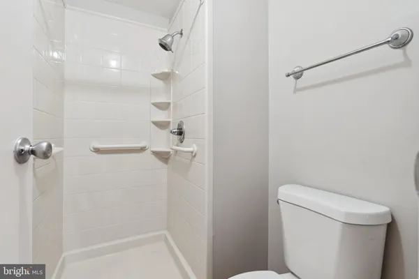 a bathroom with a toilet and shower