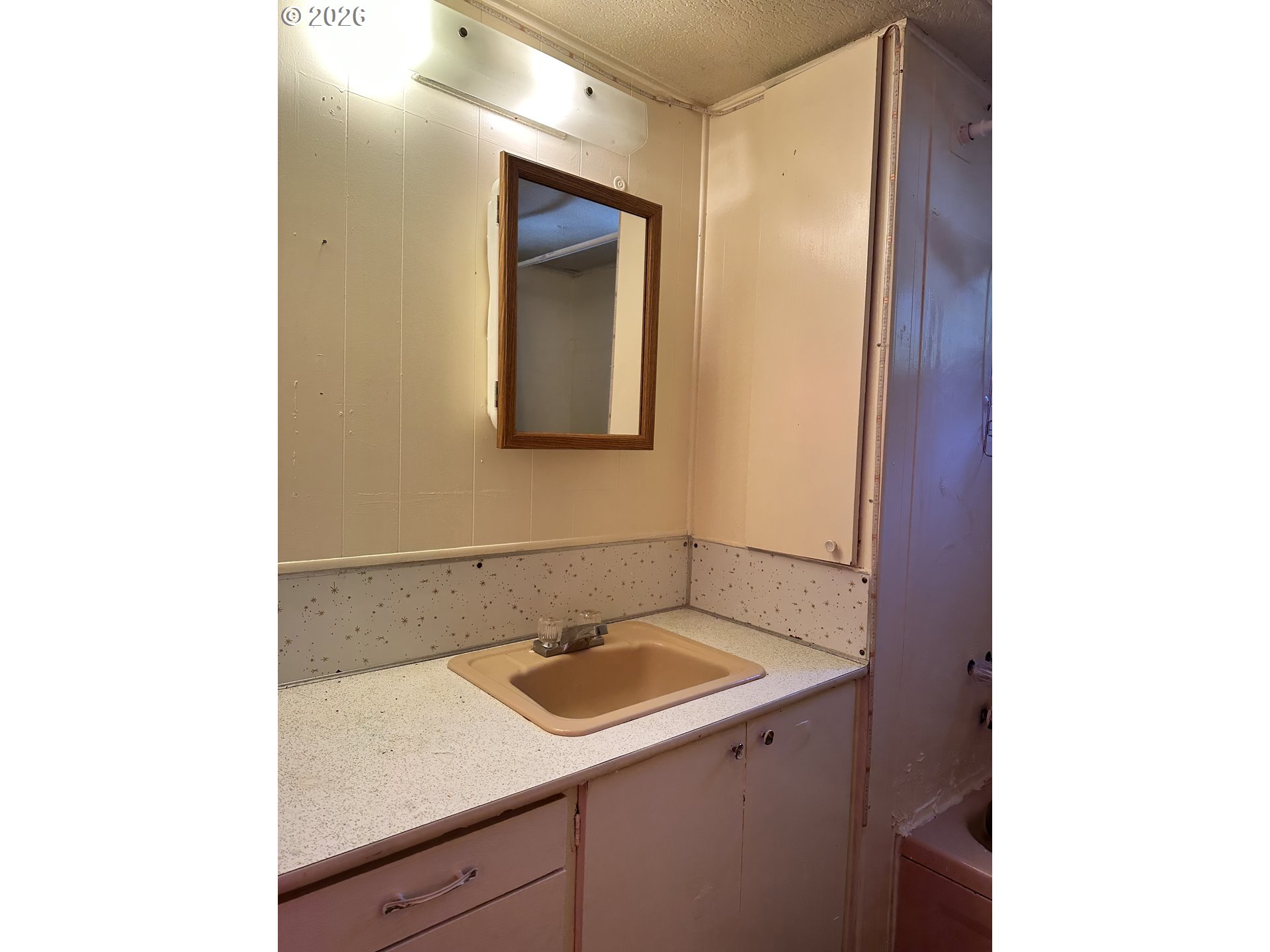 37635 Row River Road, Unit 7 Dorena, OR 97434 - Photo 19 of 27 a bathroom with a sink and a mirror