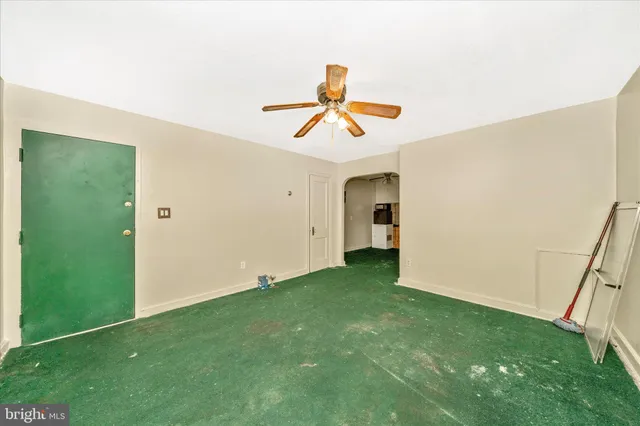 a view of front door with a room