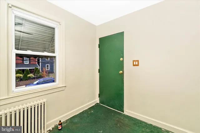 a view of room with window and ceiling fan