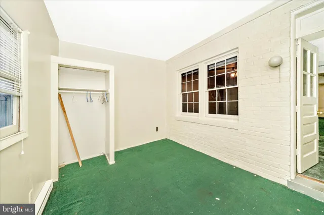 a view of front door of house with yard