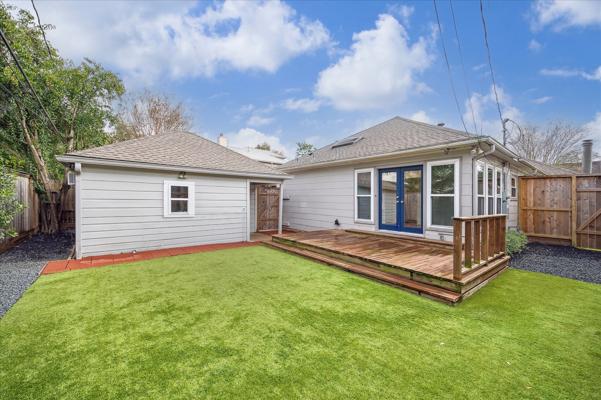 2820 Rice Boulevard West University Place, TX 77005 - Photo 27 of 37 BACKYARD. Pristine landscaping with turf and decorative hollies.
Spacious outdoor deck.
