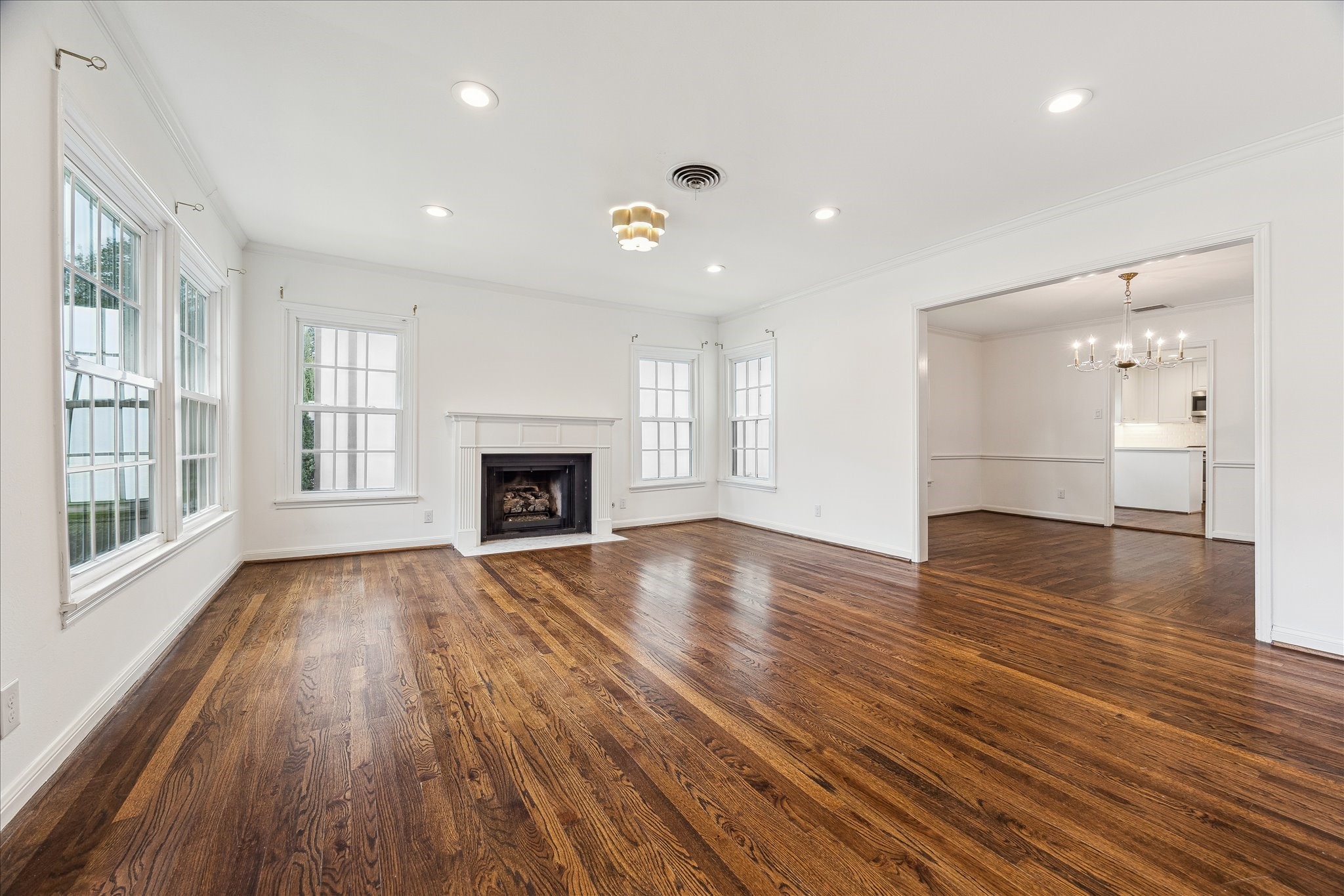 2820 Rice Boulevard West University Place, TX 77005 - Photo 4 of 37 LIVING ROOM. Shows the connection to the dining room.