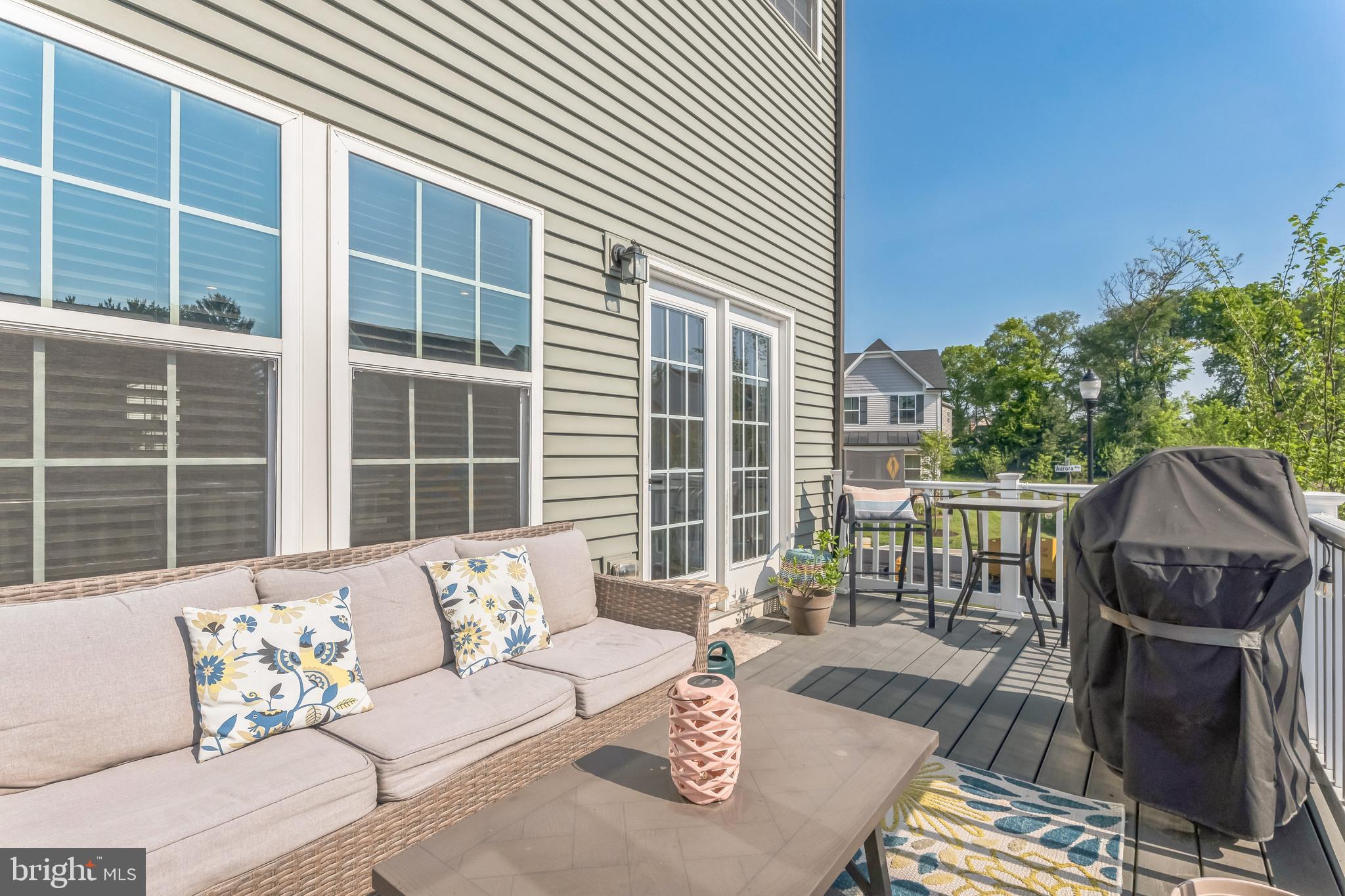 235 Edwin Road Frederick, MD 21702 - Photo 12 of 28 a view of a deck with couches with wooden floor and fence