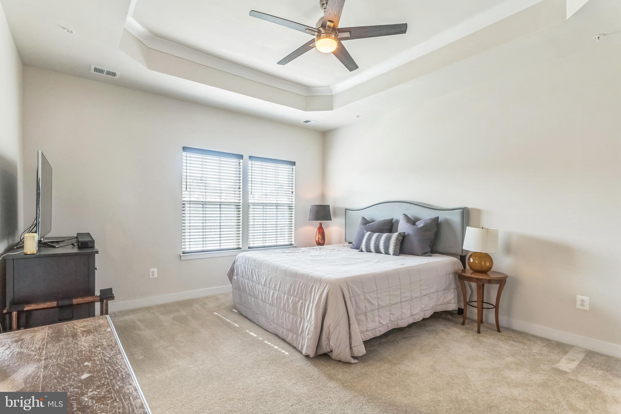235 Edwin Road Frederick, MD 21702 - Photo 13 of 28 a bedroom with a bed and a flat screen tv