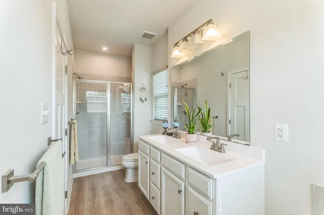 a view of a hallway to a livingroom with furniture