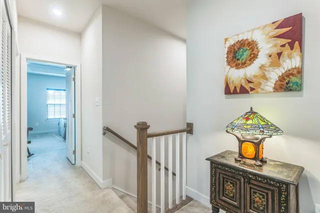 a bathroom with a sink a toilet and shower curtain