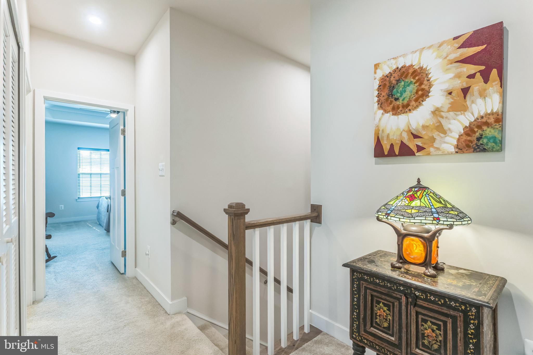 235 Edwin Road Frederick, MD 21702 - Photo 18 of 28 a view of a hallway to a livingroom with furniture