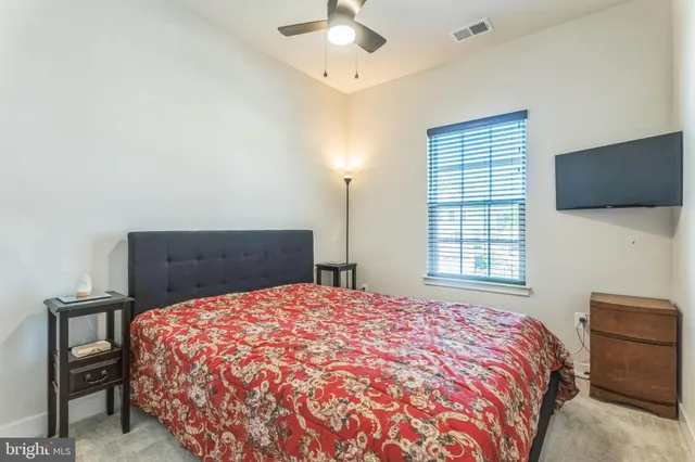 a bedroom with a bed and a closet