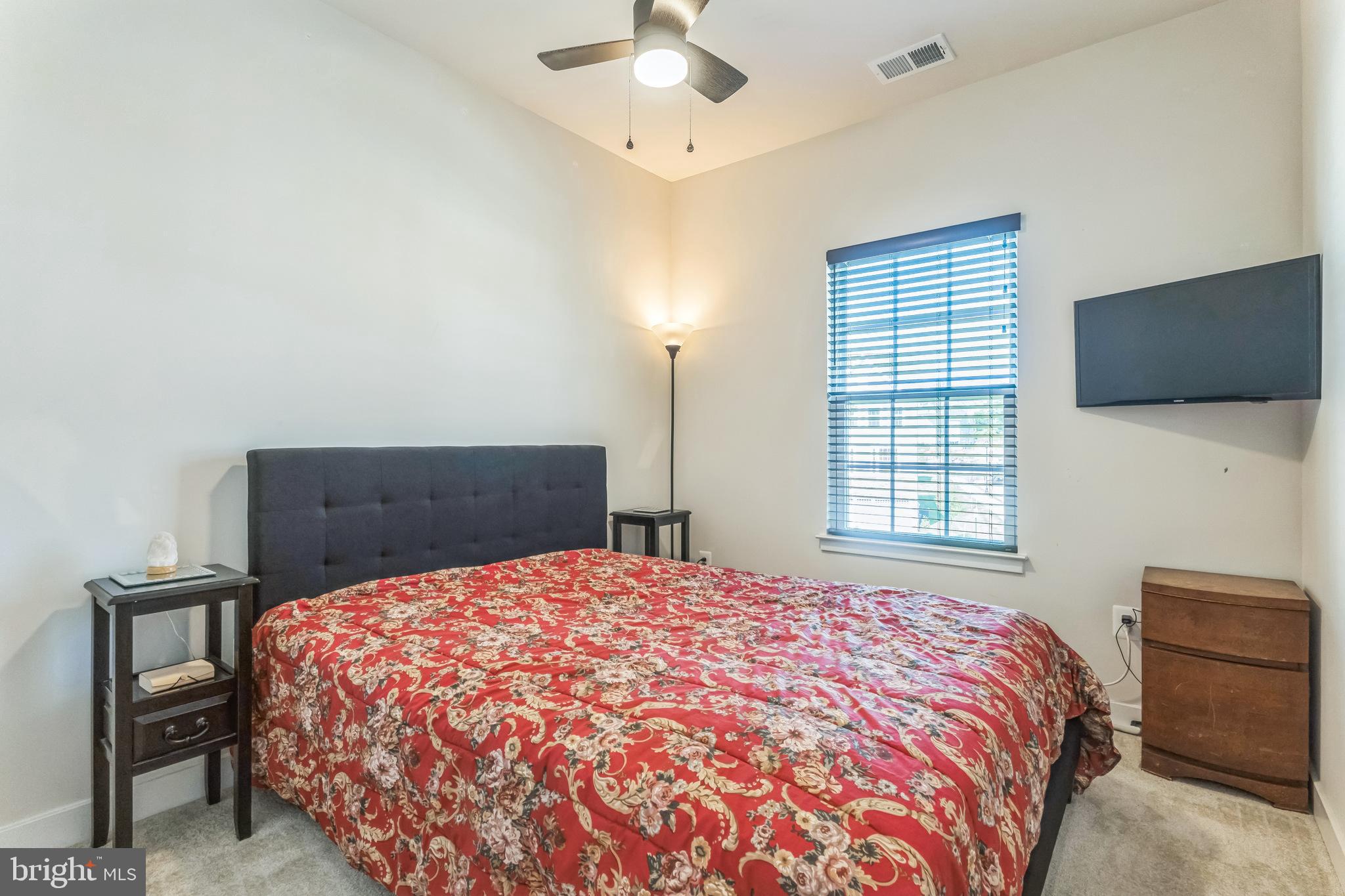 235 Edwin Road Frederick, MD 21702 - Photo 22 of 28 a bedroom with a bed and a flat screen tv