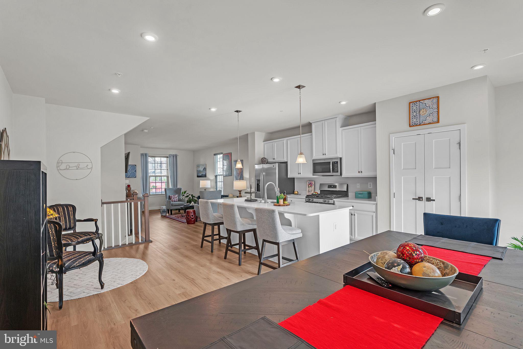 235 Edwin Road Frederick, MD 21702 - Photo 10 of 28 a living room with furniture flat screen tv and kitchen view