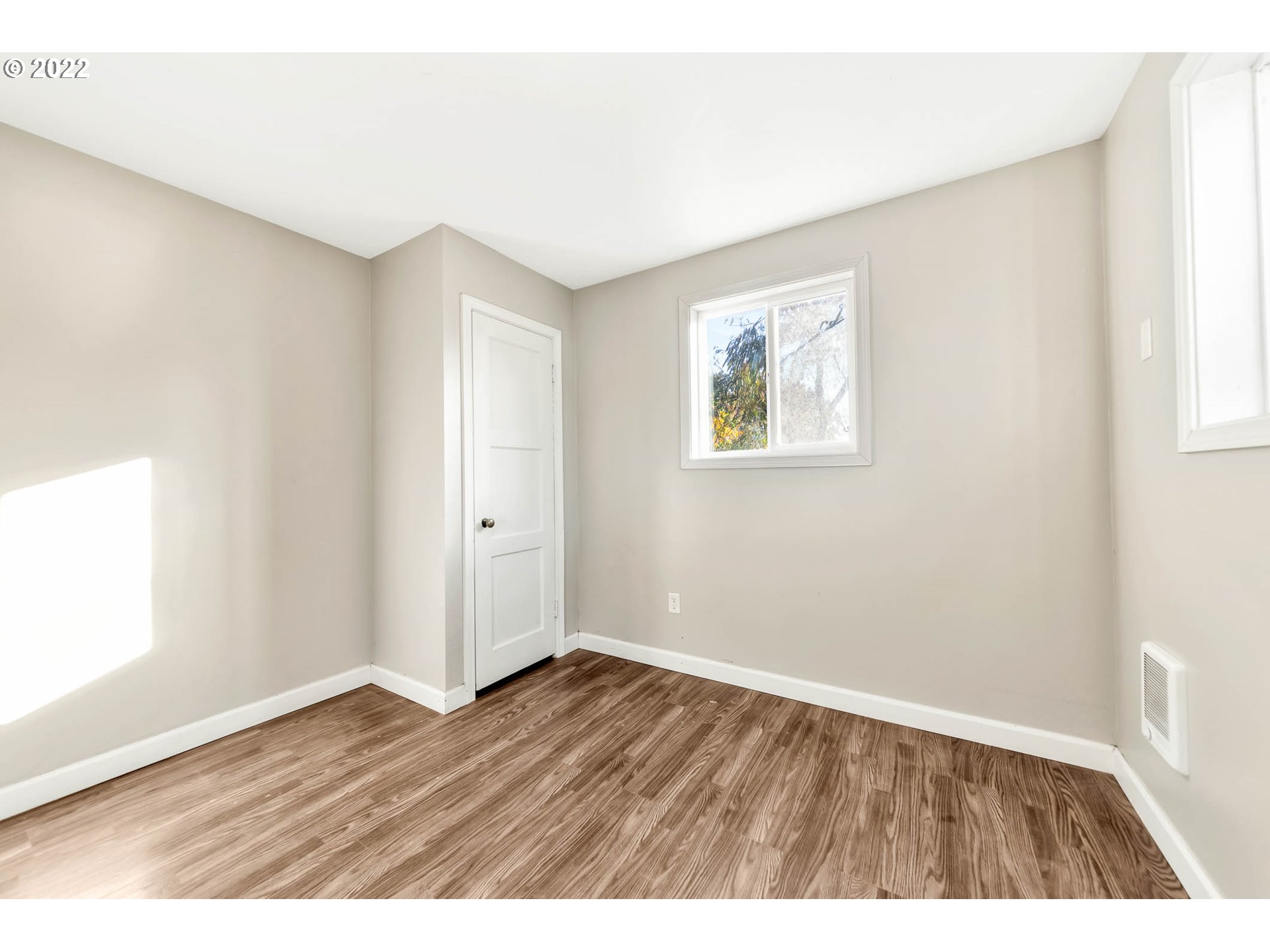 1849 H Street Springfield, OR 97477 - Photo 12 of 17 a view of an empty room with wooden floor and a window