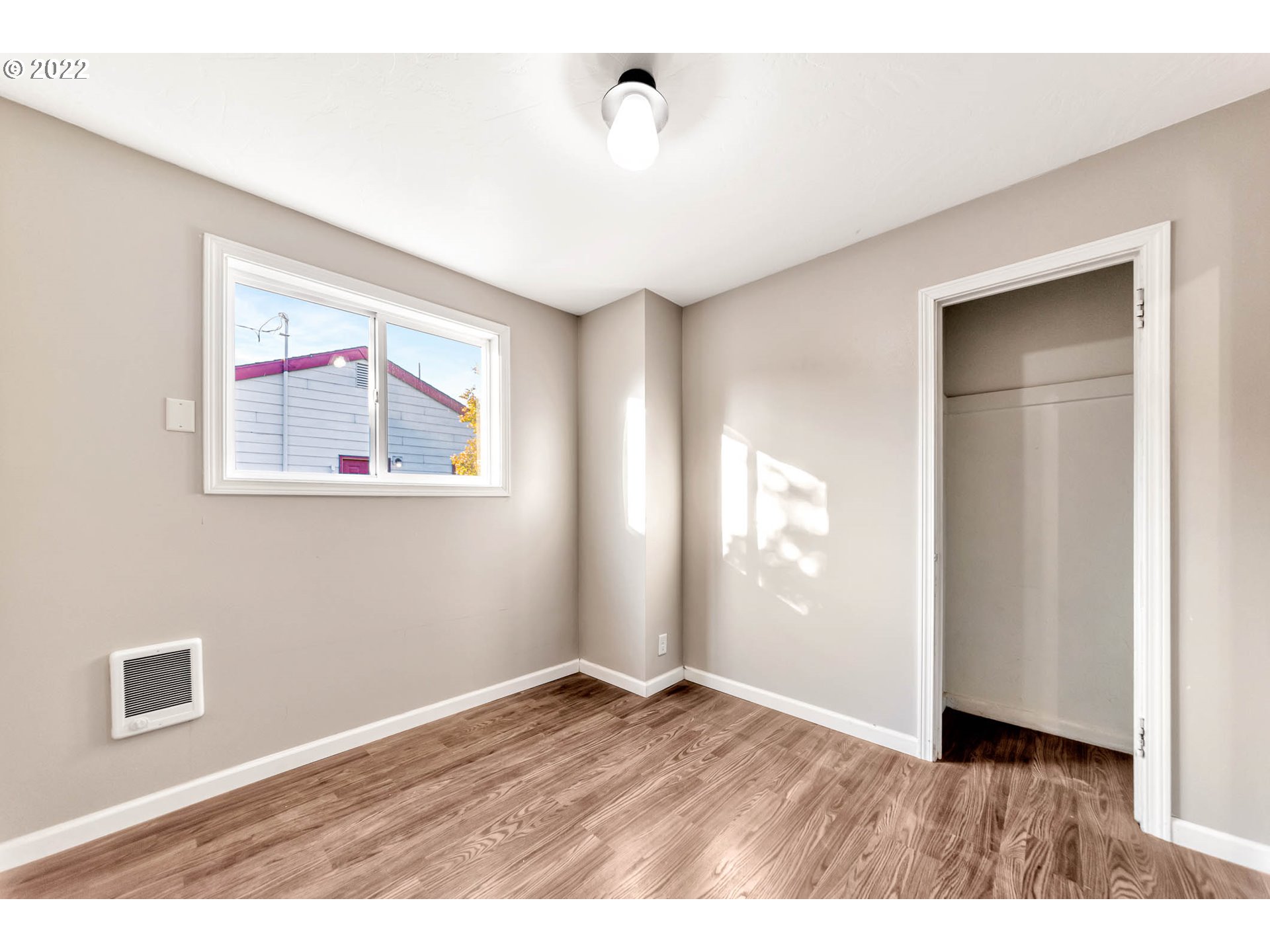 1849 H Street Springfield, OR 97477 - Photo 13 of 17 a view of an empty room with wooden floor and a window
