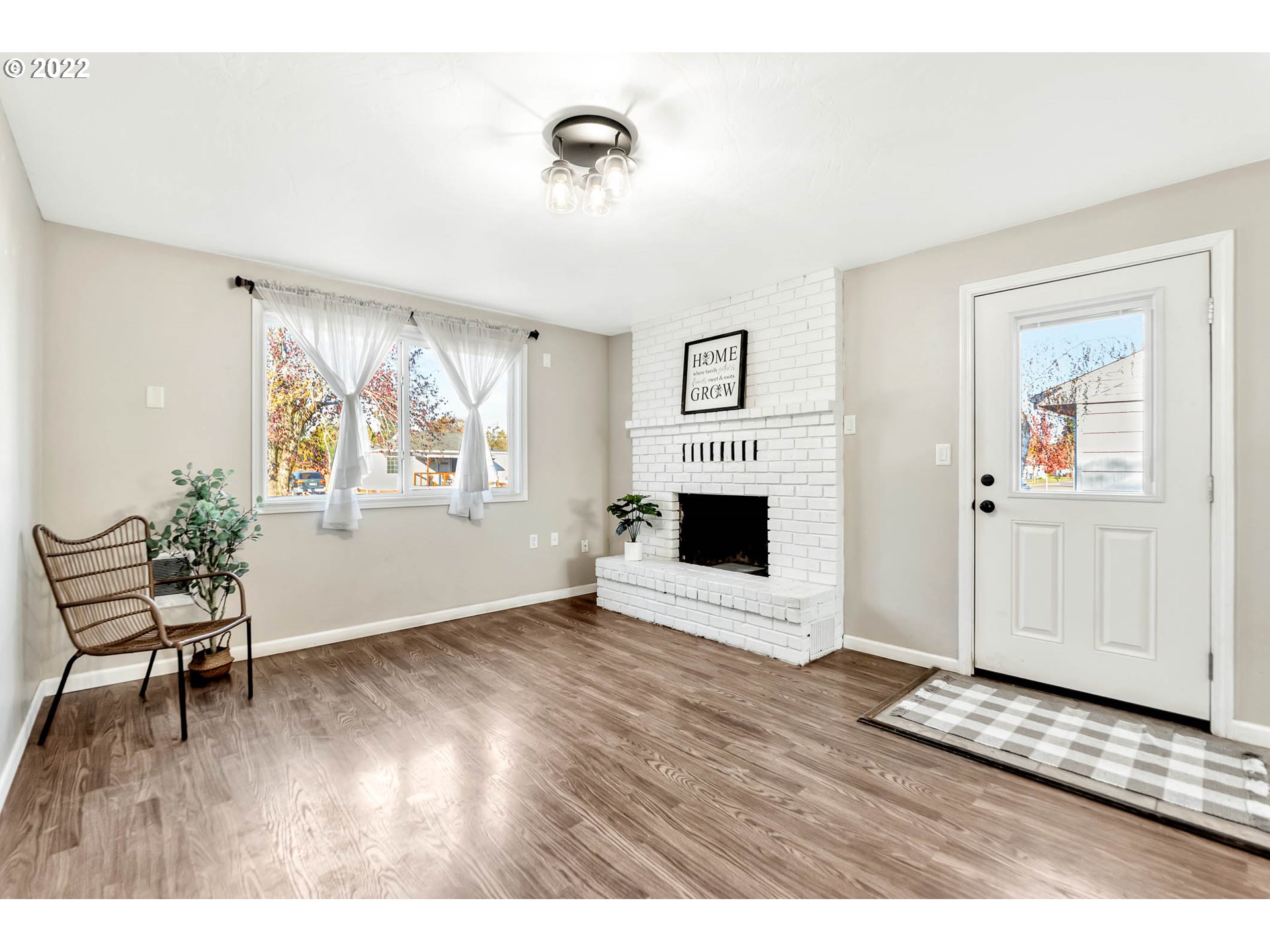 1849 H Street Springfield, OR 97477 - Photo 3 of 17 a view of a livingroom with wooden floor and a ceiling fan