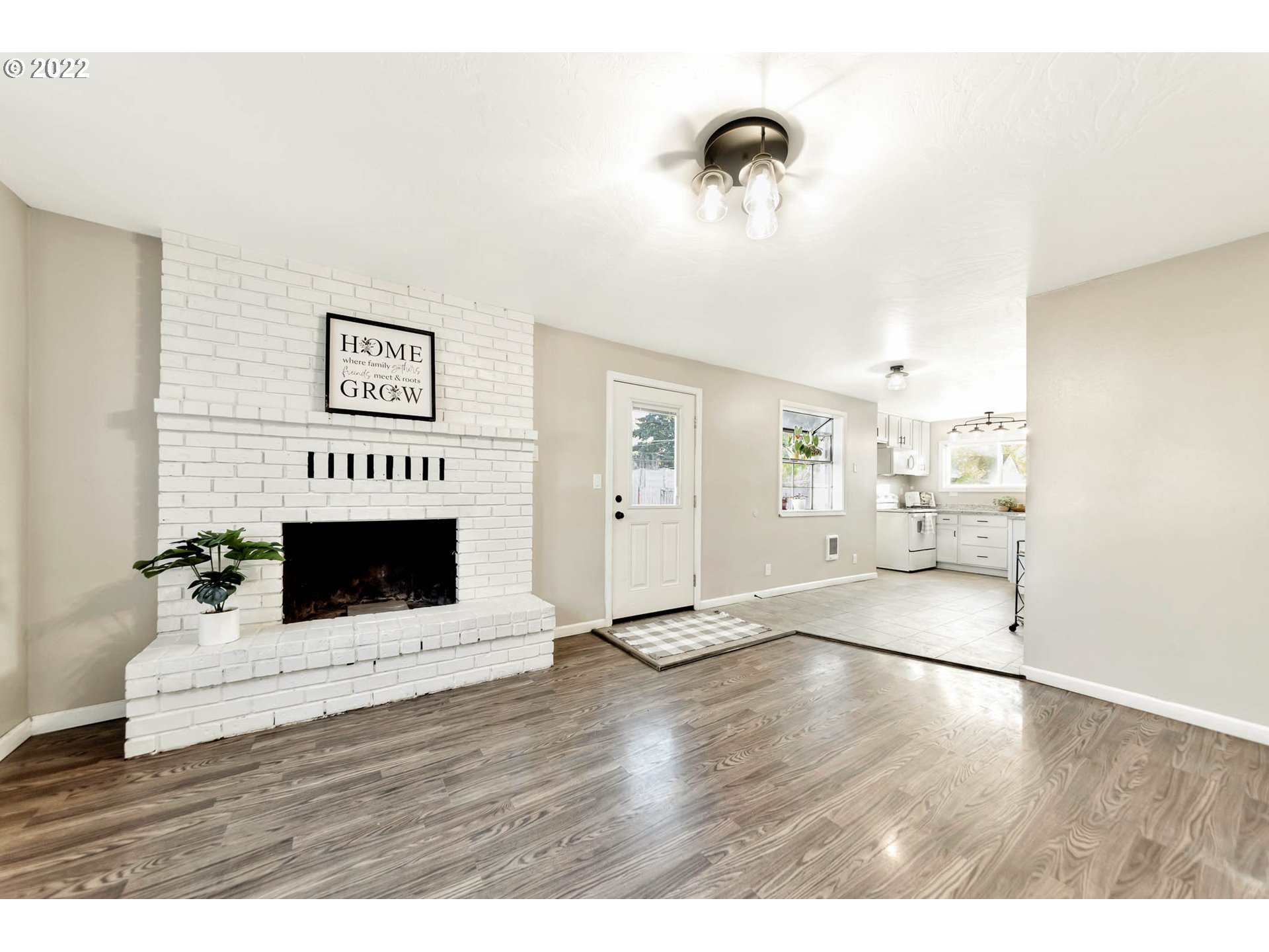 1849 H Street Springfield, OR 97477 - Photo 4 of 17 a living room with furniture wooden floor and a fireplace