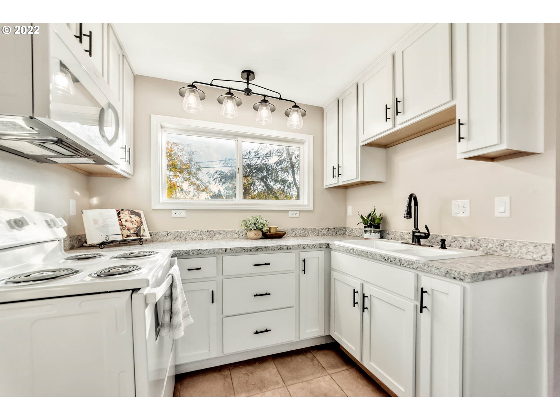 1849 H Street Springfield, OR 97477 - Photo 7 of 17 a kitchen with appliances cabinets and a window