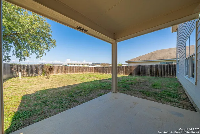 a house view with swimming pool in front of it