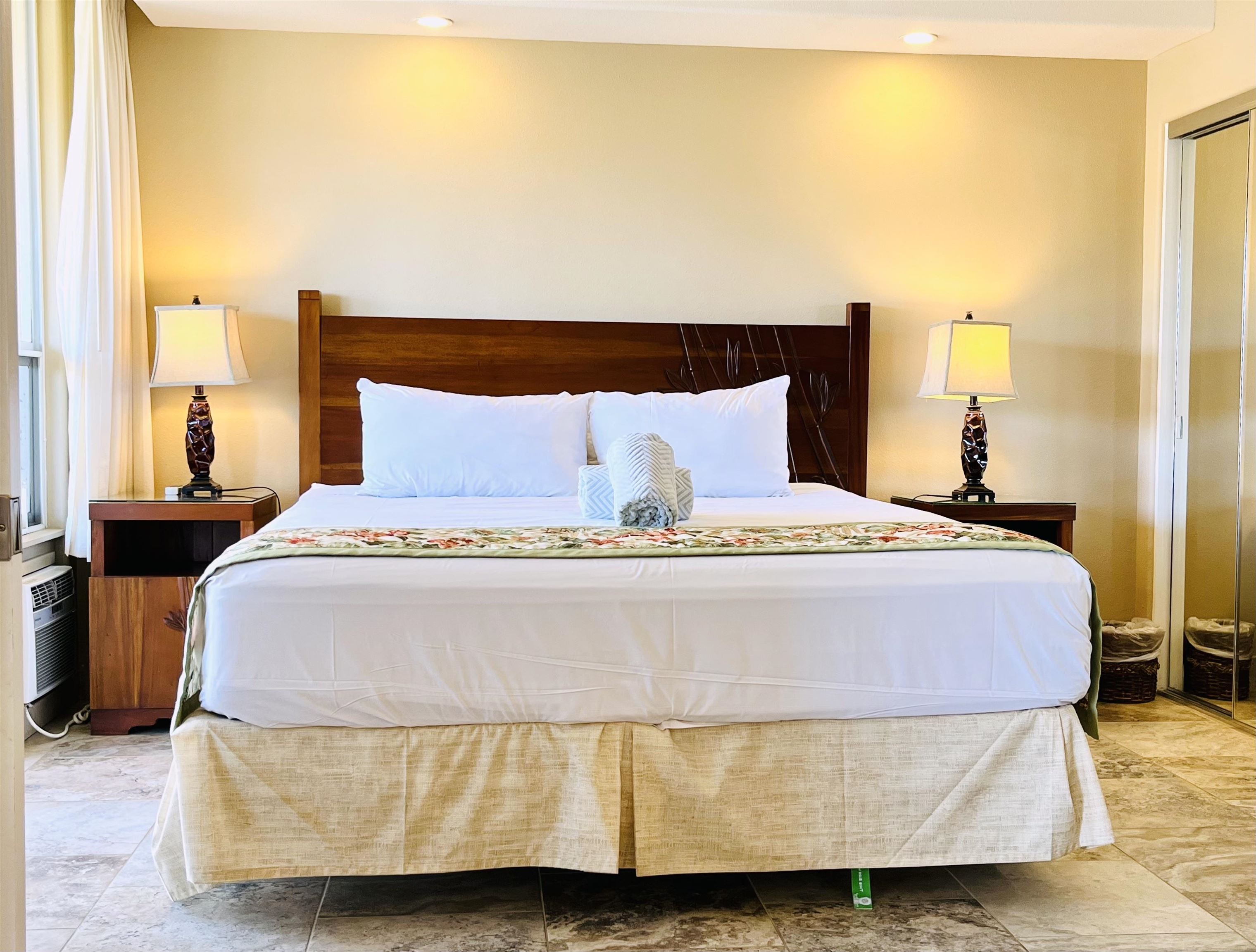 2575 South Kihei Road, Unit H414 Kihei, HI 96753 - Photo 11 of 30 a bedroom with a bed and wooden floor