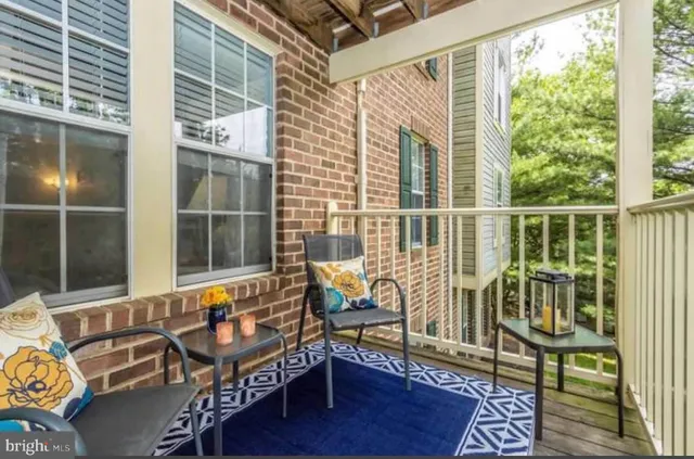 a view of a chairs and table on the deck