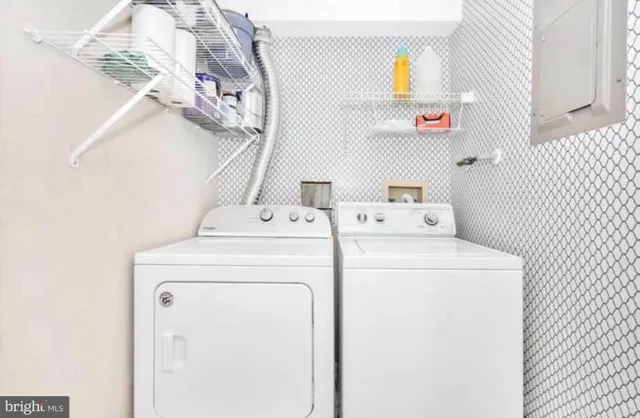 a utility room with dryer and washer