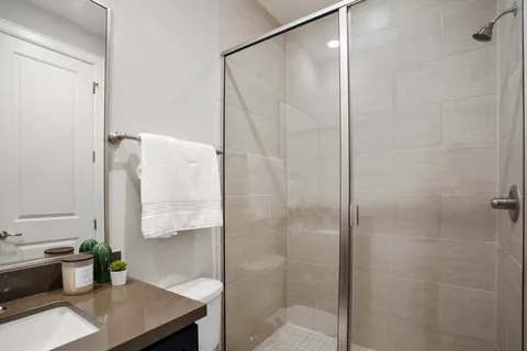 a bathroom with a shower and a sink