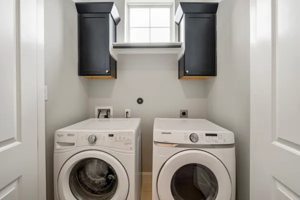 a utility room with dryer and washer