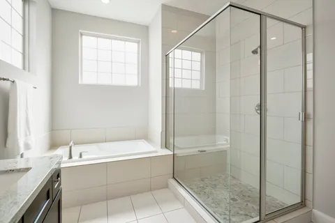 a bathroom with a bathtub and a shower