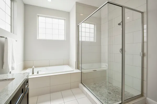 a bathroom with a bathtub and a shower