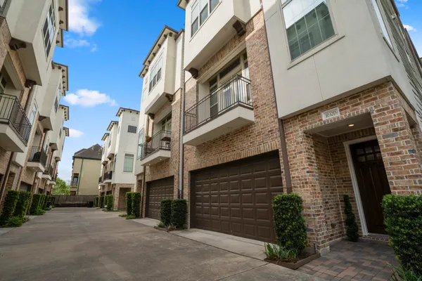 a view of a brick building with many windows