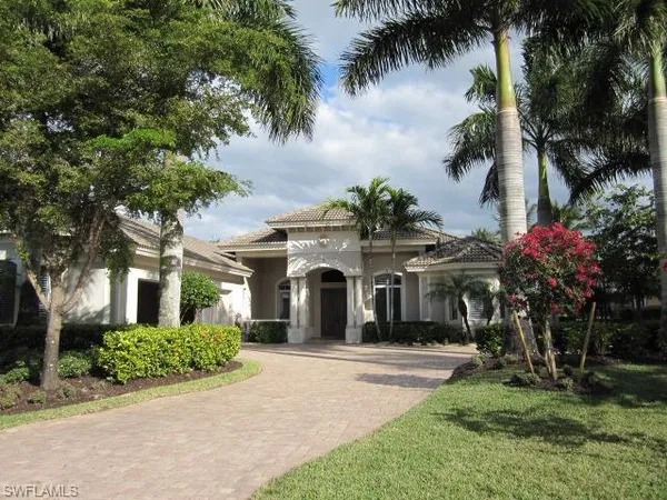 front view of a house with a garden