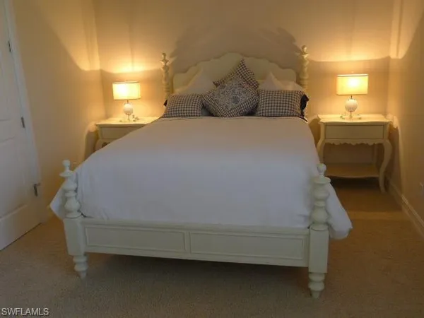 a bedroom with a bed and a table