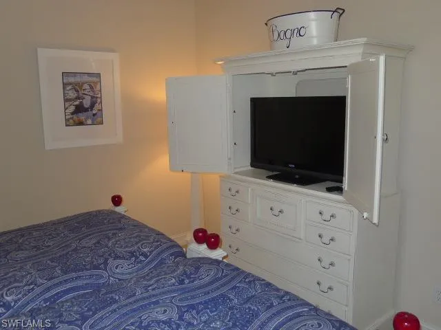 a kitchen with a refrigerator and table