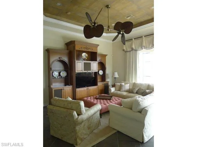 a living room with couches and fireplace