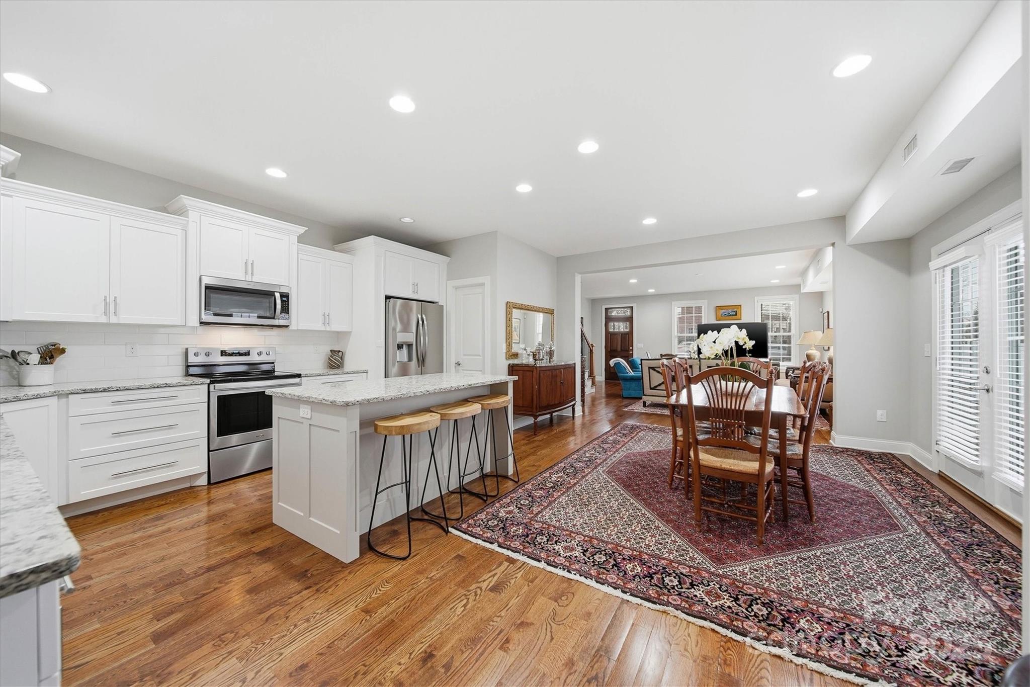 1449 North Center Street Hickory, NC 28601 - Photo 11 of 34 a kitchen with sink a table and chairs