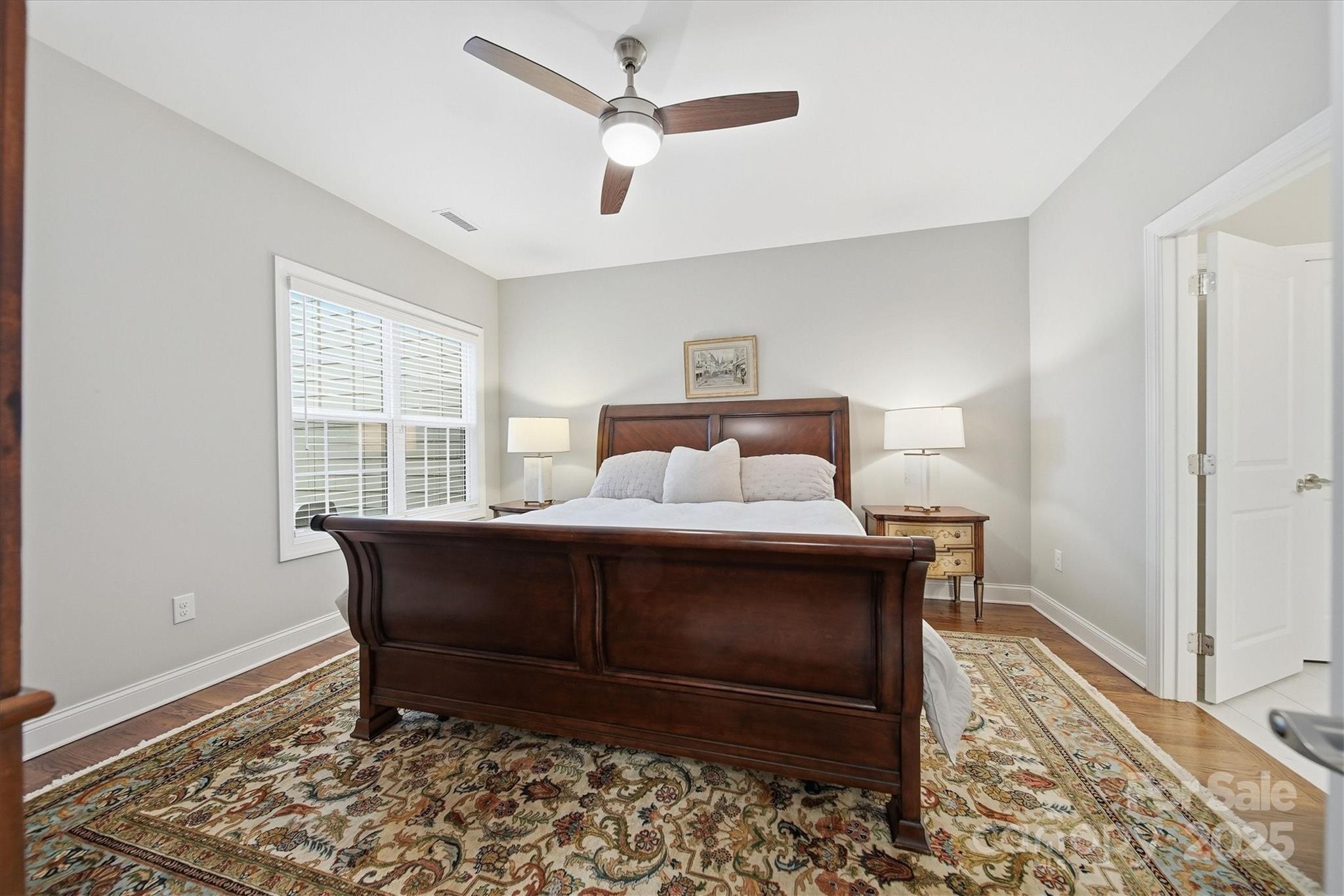 1449 North Center Street Hickory, NC 28601 - Photo 14 of 34 a bedroom with a bed and wooden floor