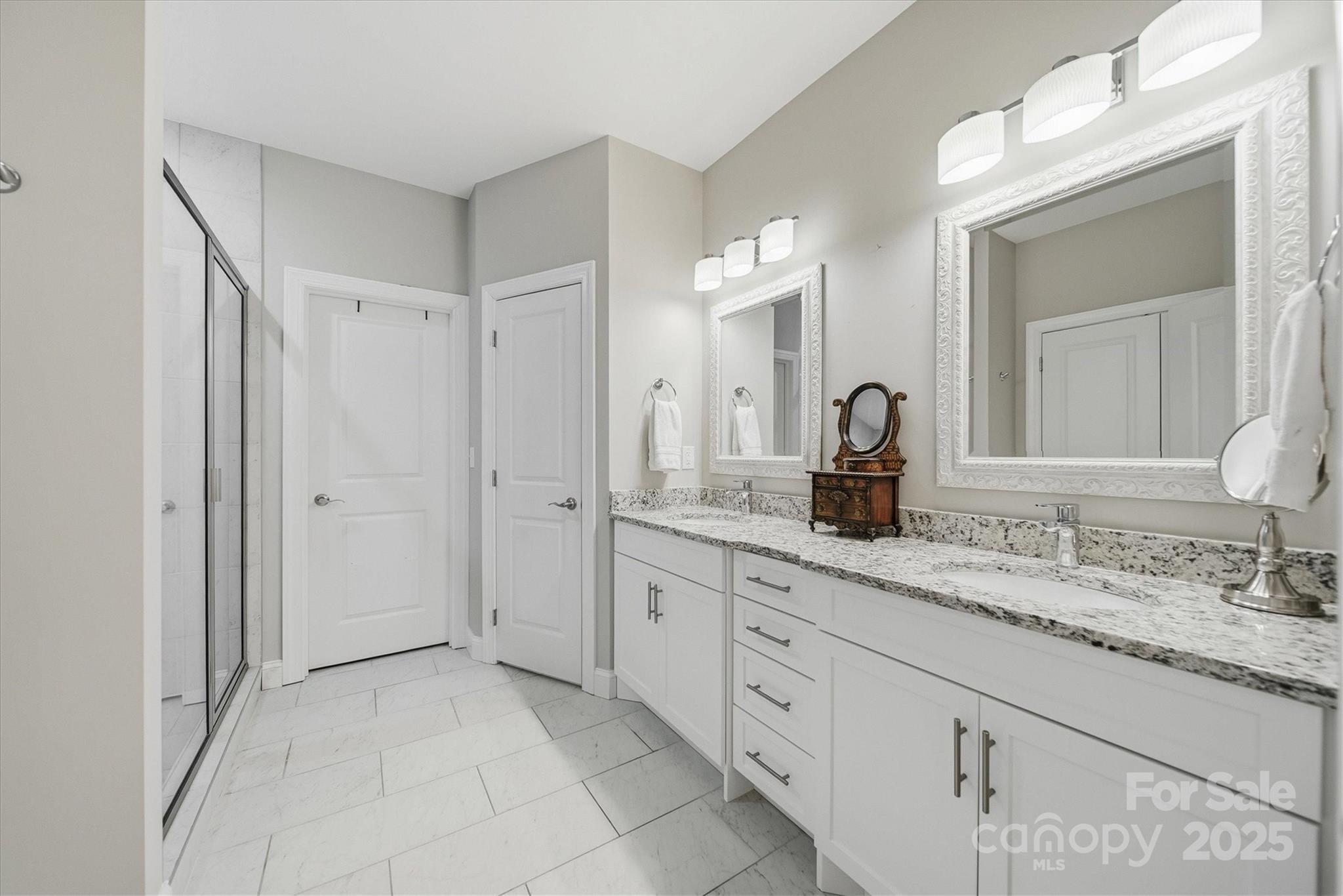 1449 North Center Street Hickory, NC 28601 - Photo 16 of 34 a bathroom with a granite countertop sink mirror and a