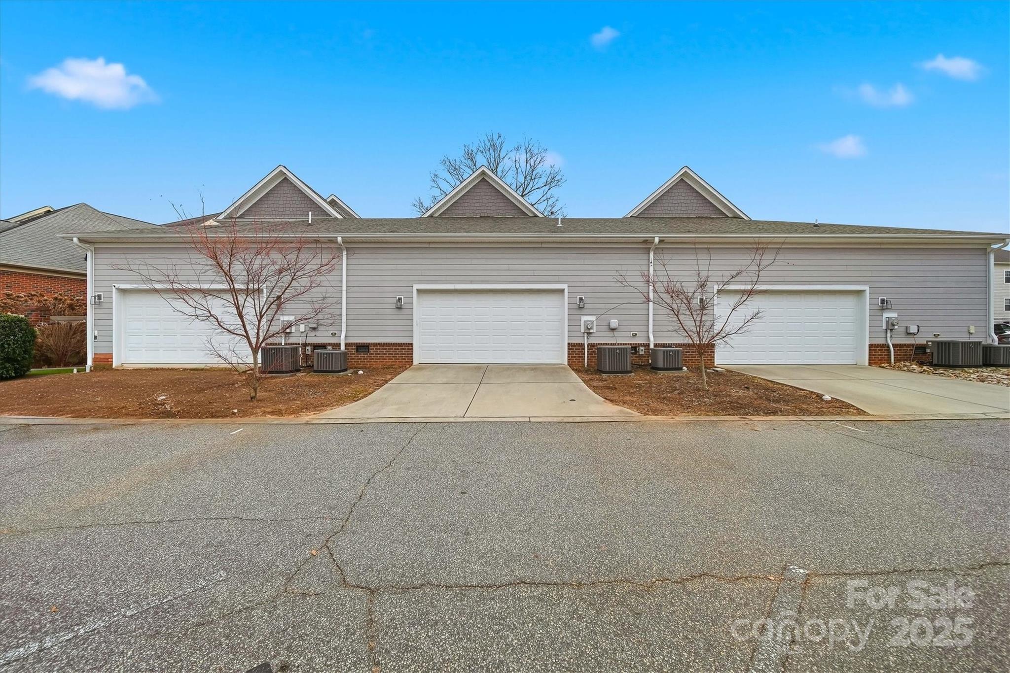 1449 North Center Street Hickory, NC 28601 - Photo 28 of 34 a front view of a house with a yard and garage