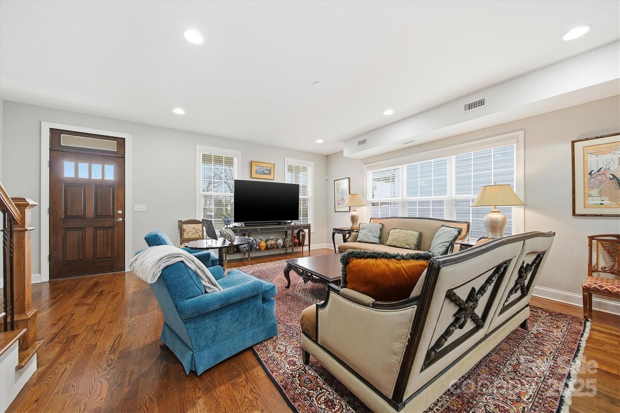 1449 North Center Street Hickory, NC 28601 - Photo 6 of 34 a living room with furniture and a flat screen tv