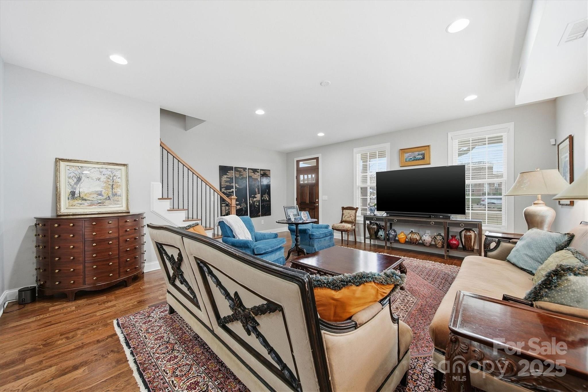 1449 North Center Street Hickory, NC 28601 - Photo 7 of 34 a living room with furniture and a flat screen tv