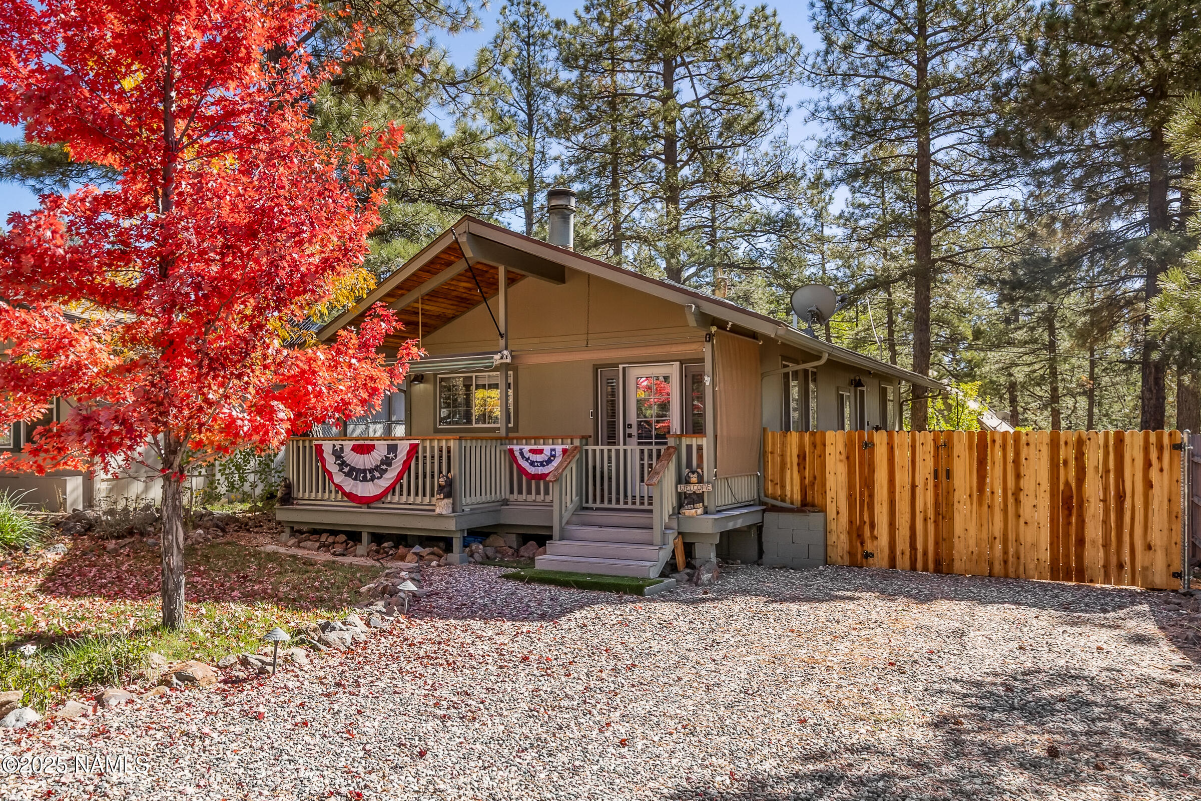 a view of a back yard of the house and car parked