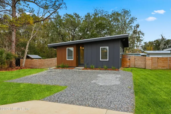 a backyard of a house with lots of green space