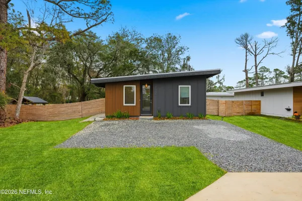 front view of a house with a yard