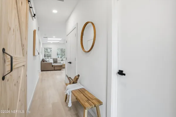 a very nice looking room with a large window and mirror